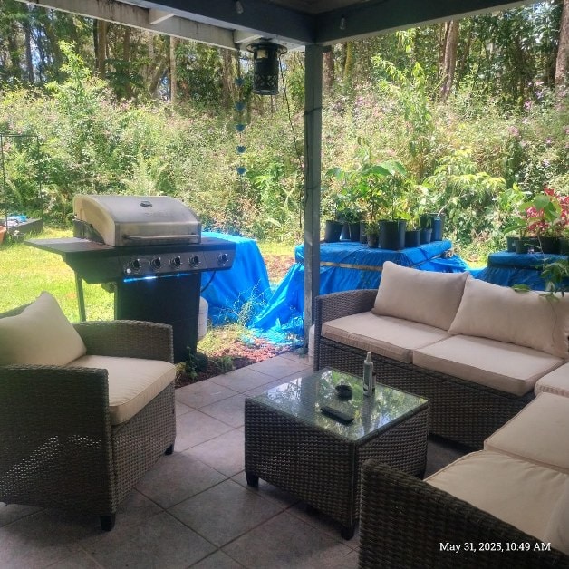 13-3313 Moku St, Pahoa, HI 96778 - view of patio with an outdoor hangout area and a grill