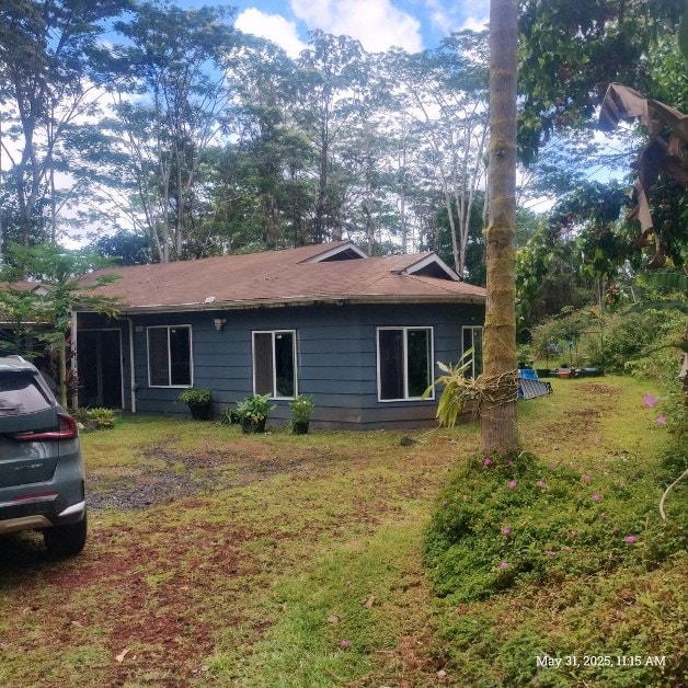 13-3313 Moku St, Pahoa, HI 96778 - rear view of house featuring a yard and a shingled roof