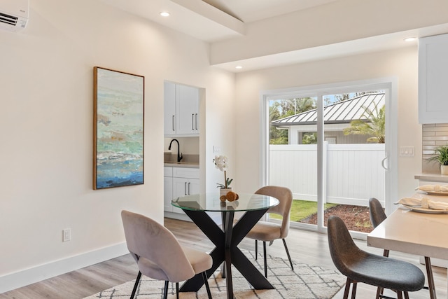 16-2068 Bamboo Dr, Pahoa, HI 96778 - dining area with light wood-type flooring, a wall mounted air conditioner, recessed lighting, and baseboards