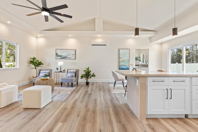 16-2068 Bamboo Dr, Pahoa, HI 96778 - kitchen featuring open floor plan, lofted ceiling, white cabinetry, light wood finished floors, and a ceiling fan