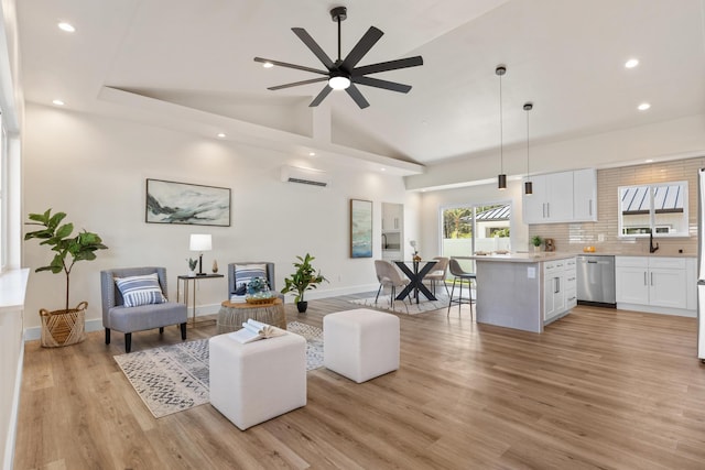 16-2068 Bamboo Dr, Pahoa, HI 96778 - living area featuring light wood finished floors, recessed lighting, an AC wall unit, a ceiling fan, and baseboards