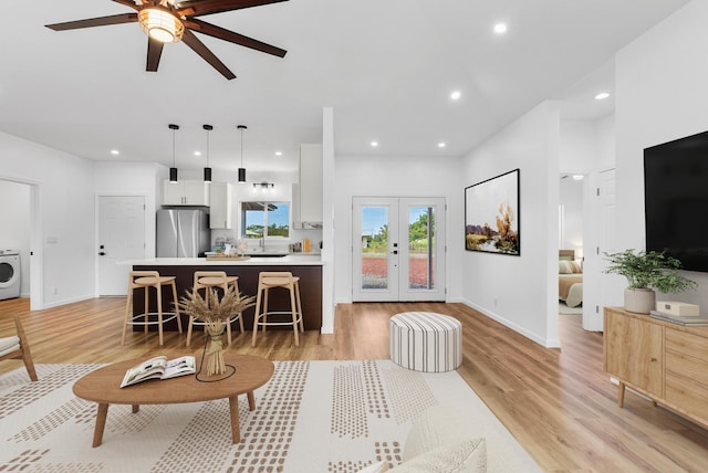 15-1770 10th Ave, Keaau, HI 96749 - living room with ceiling fan, washer / dryer, light wood-type flooring, recessed lighting, and french doors
