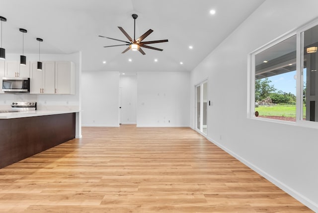 15-1770 10th Ave, Keaau, HI 96749 - unfurnished living room with light wood-style floors, a ceiling fan, recessed lighting, vaulted ceiling, and baseboards