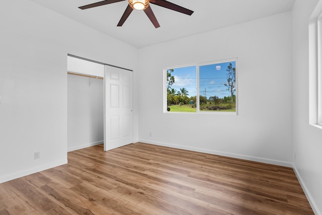 15-1770 10th Ave, Keaau, HI 96749 - unfurnished bedroom featuring light wood-style flooring, a closet, baseboards, and ceiling fan