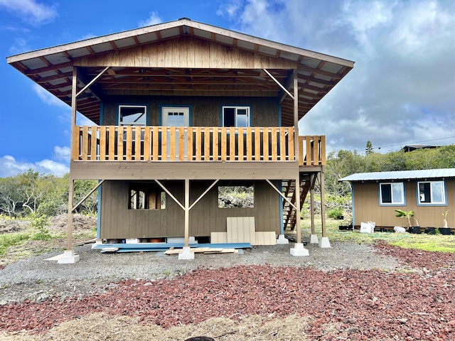94-6479 Puukani Rd, Naalehu, HI 96772 - back of property featuring a wooden deck and stairway