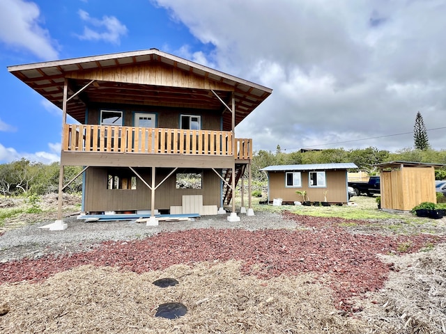 94-6479 Puukani Rd, Naalehu, HI 96772 - rear view of property featuring stairs and a deck
