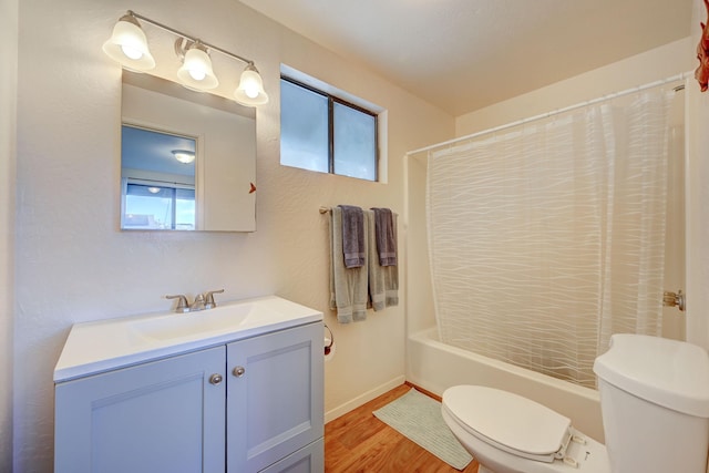 12-7040 Kaihalulu St, Pahoa, HI 96778 - full bathroom featuring toilet, vanity, wood finished floors, and healthy amount of natural light