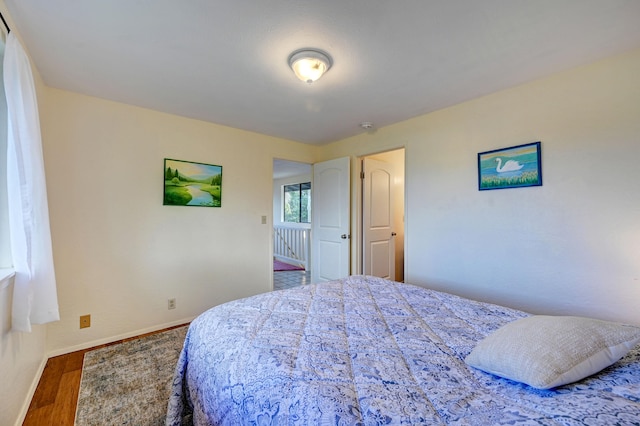 12-7040 Kaihalulu St, Pahoa, HI 96778 - bedroom with wood finished floors and baseboards