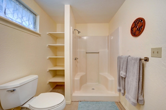 12-7040 Kaihalulu St, Pahoa, HI 96778 - bathroom with toilet, a shower, and tile patterned flooring