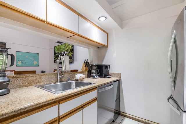 2253 Poipu Rd Unit 230, Koloa, HI 96756 - kitchen with stainless steel appliances, white cabinetry, light tile patterned flooring, and recessed lighting