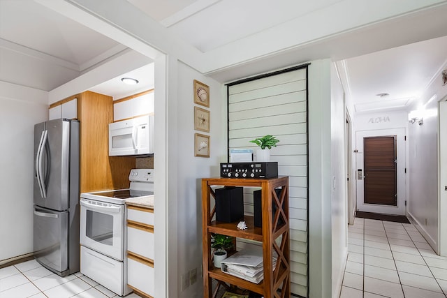 2253 Poipu Rd Unit 230, Koloa, HI 96756 - kitchen with white appliances, light tile patterned floors, and light countertops