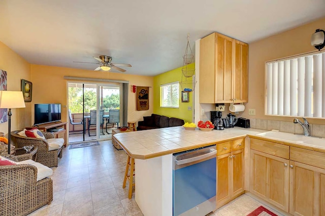 12-7036 Kaiwa St, Pahoa, HI 96778 - kitchen with stainless steel dishwasher, open floor plan, and light brown cabinetry