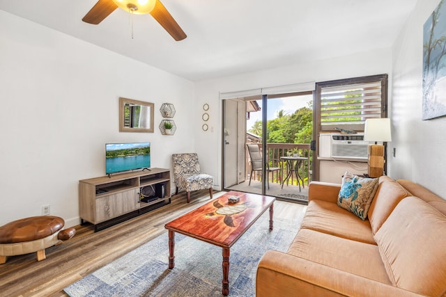 3411 Wilcox Rd Unit F 69, Lihue, HI 96766 - living area with wood finished floors, a ceiling fan, and cooling unit