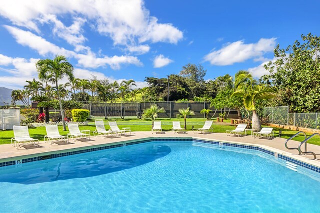 3411 Wilcox Rd Unit F 69, Lihue, HI 96766 - community pool with a patio area