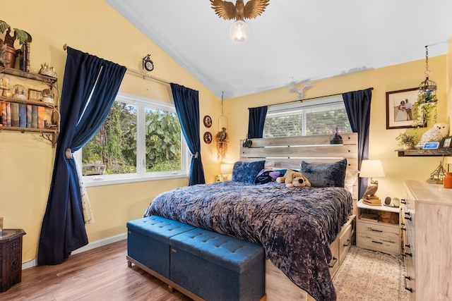 15-2693 Oio St, Pahoa, HI 96778 - bedroom with multiple windows, vaulted ceiling, wood finished floors, and baseboards