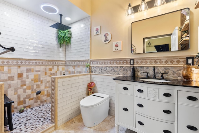 15-2693 Oio St, Pahoa, HI 96778 - full bathroom featuring vanity, toilet, walk in shower, tile walls, and a wainscoted wall