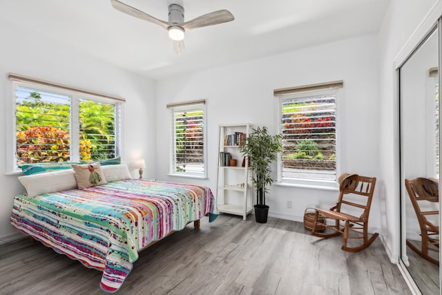 76-4391 Leilani St, Kailua-Kona, HI 96740 - bedroom featuring wood finished floors, multiple windows, and a ceiling fan