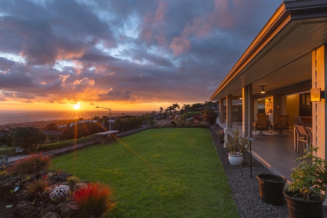 76-4391 Leilani St, Kailua-Kona, HI 96740 - yard at dusk with a patio area and a lawn