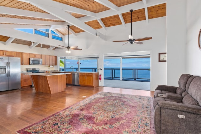 87-3181 Japonica Rd, Captain Cook, HI 96704 - kitchen with appliances with stainless steel finishes, open floor plan, ceiling fan, light countertops, and high vaulted ceiling