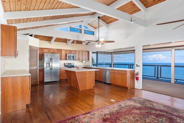 87-3181 Japonica Rd, Captain Cook, HI 96704 - kitchen featuring appliances with stainless steel finishes, ceiling fan, light countertops, dark wood-style flooring, and a wooden ceiling with exposed beams