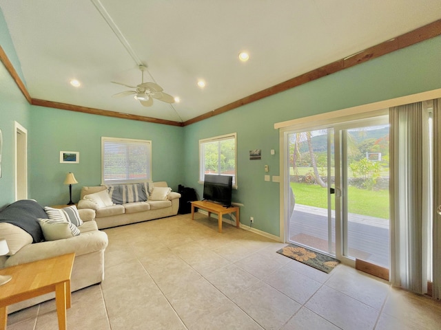 95-5974-A Mamalahoa Hwy, Naalehu, HI 96772 - living room with ornamental molding, lofted ceiling, light tile patterned flooring, a ceiling fan, and baseboards