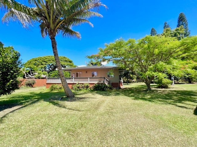 95-5974-A Mamalahoa Hwy, Naalehu, HI 96772 - view of green lawn with a wooden deck