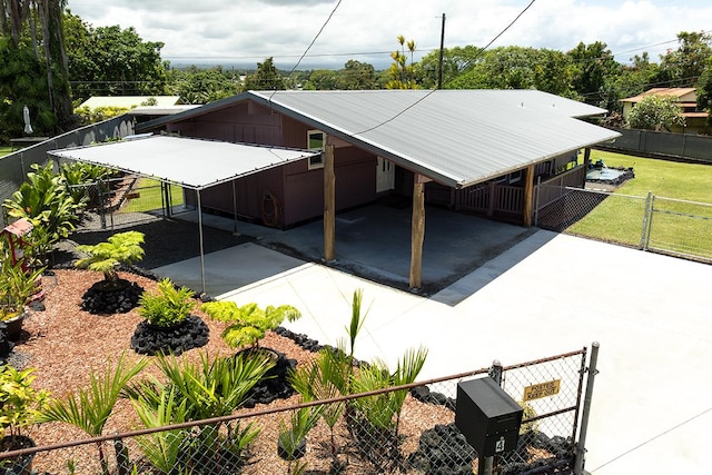 4 Nani Pl, Hilo, HI 96720 - view of property exterior with a gate, concrete driveway, a carport, and metal roof