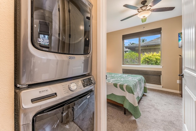 68-1376 Pauoa Rd Unit E1, Kamuela, HI 96743 - washroom featuring stacked washer and clothes dryer, carpet floors, and a ceiling fan
