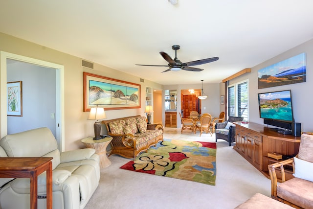 76-6212 Alii Dr Unit 205, Kailua-Kona, HI 96740 - living area featuring ceiling fan and light colored carpet