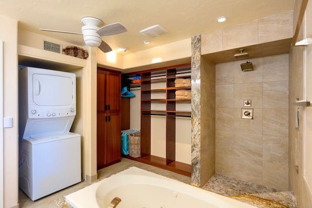 76-6212 Alii Dr Unit 205, Kailua-Kona, HI 96740 - bathroom with stacked washer / dryer, a ceiling fan, a whirlpool tub, and tiled shower