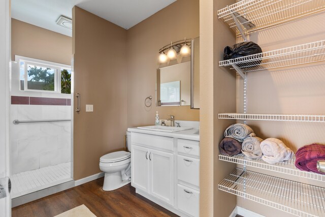 36-2331 Old Mamalahoa Hwy, Laupahoehoe, HI 96764 - full bath with vanity, toilet, wood finished floors, tiled shower, and baseboards