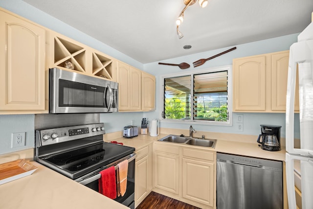4460 Nehe Rd Unit 228, Lihue, HI 96766 - kitchen with stainless steel appliances, light countertops, cream cabinets, and dark wood-type flooring