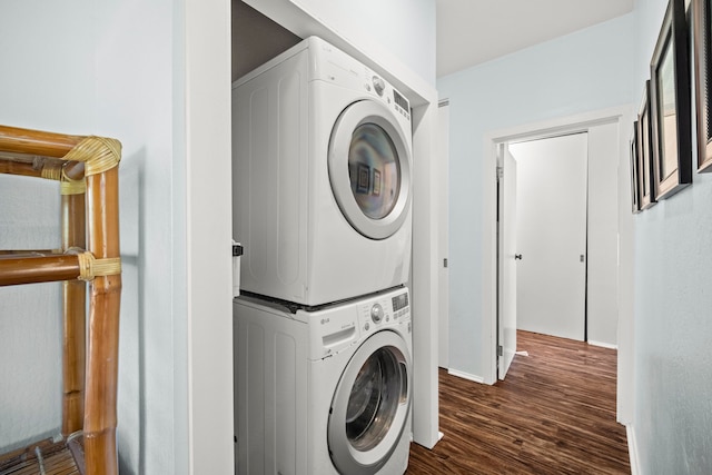4460 Nehe Rd Unit 228, Lihue, HI 96766 - washroom with stacked washer and clothes dryer and wood finished floors