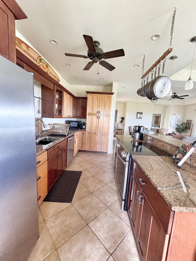 77-6450 Walua Rd, Kailua-Kona, HI 96740 - kitchen featuring a sink, ceiling fan, stainless steel appliances, light stone counters, and glass insert cabinets