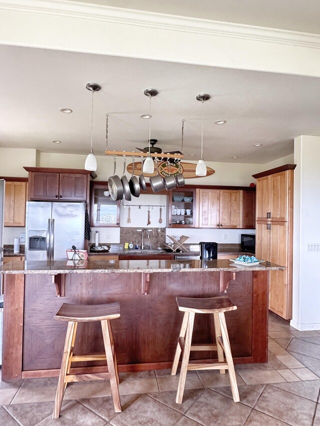 77-6450 Walua Rd, Kailua-Kona, HI 96740 - kitchen with stainless steel fridge, a sink, backsplash, dark stone countertops, and recessed lighting
