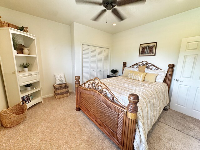 77-6450 Walua Rd, Kailua-Kona, HI 96740 - bedroom with light carpet, a closet, ceiling fan, and baseboards