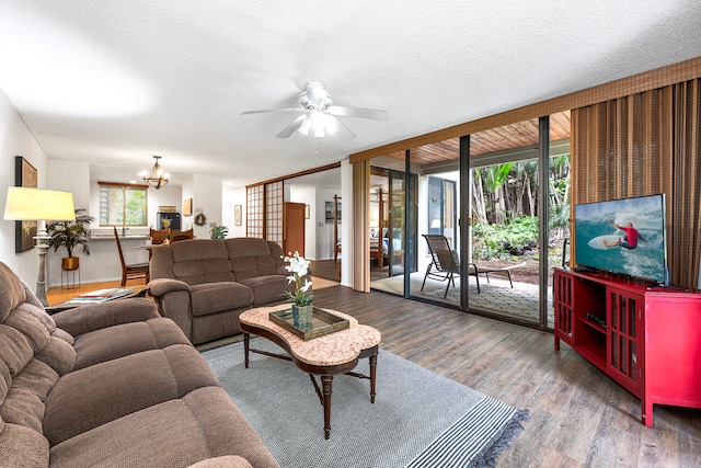78-6800 Alii Dr Unit 8104, Kailua-Kona, HI 96740 - living room featuring wood finished floors, a chandelier, ceiling fan, and a textured ceiling
