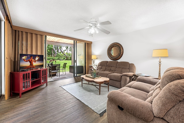 78-6800 Alii Dr Unit 8104, Kailua-Kona, HI 96740 - living room with a ceiling fan, wood finished floors, a wall of windows, and a textured ceiling