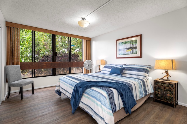 78-6800 Alii Dr Unit 8104, Kailua-Kona, HI 96740 - bedroom featuring wood finished floors and a textured ceiling