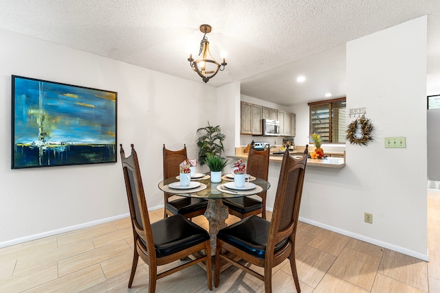 78-6800 Alii Dr Unit 8104, Kailua-Kona, HI 96740 - dining area featuring wood finish floors, a textured ceiling, a chandelier, and recessed lighting