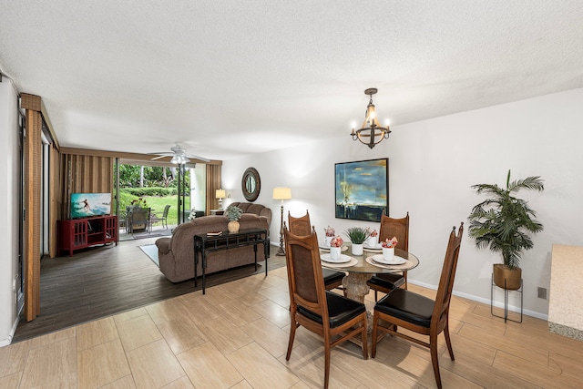 78-6800 Alii Dr Unit 8104, Kailua-Kona, HI 96740 - dining space featuring a chandelier, light wood finished floors, a textured ceiling, and a ceiling fan