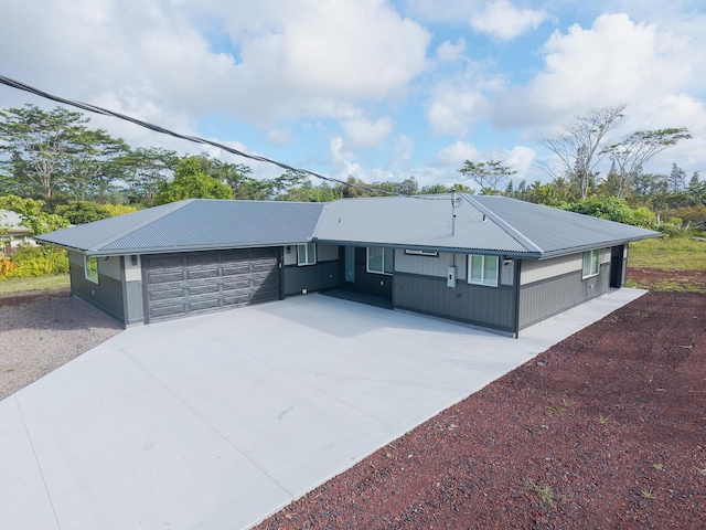 15-1776 6th Ave, Keaau, HI 96749 - ranch-style house featuring concrete driveway, an attached garage, and metal roof