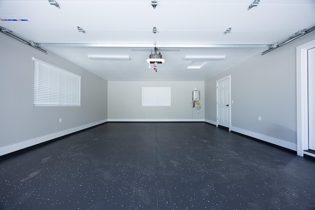 15-1776 6th Ave, Keaau, HI 96749 - garage featuring water heater, a garage door opener, and baseboards