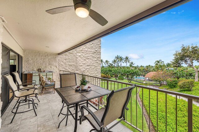 78-7070 Alii Dr Unit C201, Kailua-Kona, HI 96740 - balcony with a ceiling fan and outdoor dining area