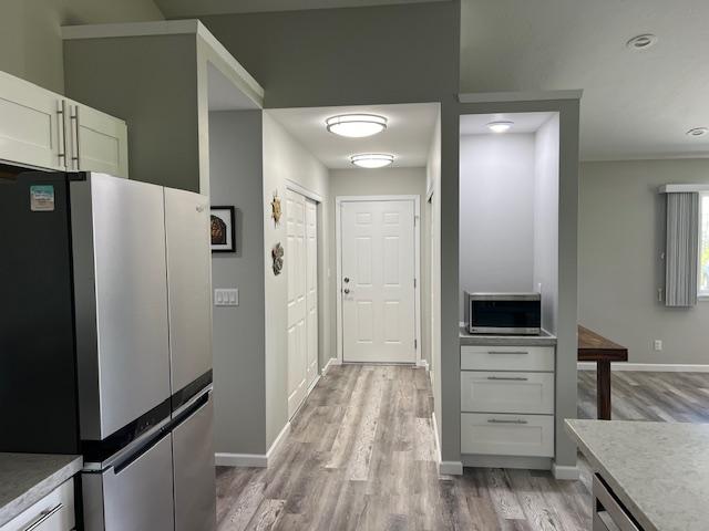 16-553 Orchidland Dr, Kurtistown, HI 96760 - kitchen with appliances with stainless steel finishes, light wood-type flooring, and light countertops