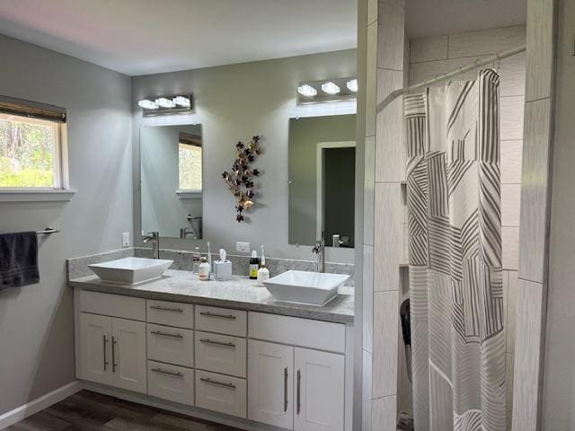 16-553 Orchidland Dr, Kurtistown, HI 96760 - full bath featuring double vanity, a shower with curtain, and wood finished floors