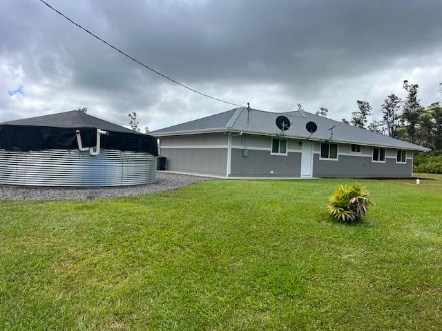 16-553 Orchidland Dr, Kurtistown, HI 96760 - rear view of property featuring a yard