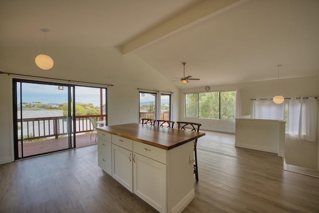 68-1780 Puu Nui St, Waikoloa, HI 96738 - kitchen with butcher block countertops, open floor plan, a ceiling fan, dark wood-style floors, and hanging light fixtures