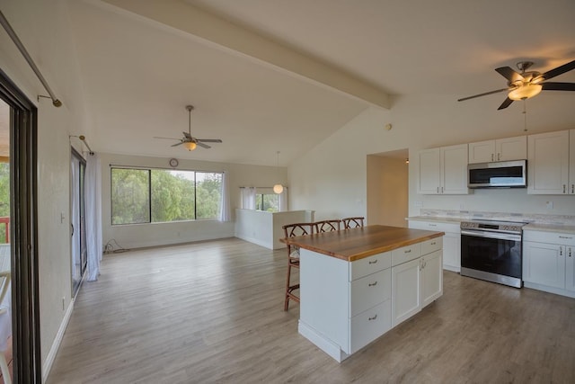 68-1780 Puu Nui St, Waikoloa, HI 96738 - kitchen with stainless steel appliances, a ceiling fan, beamed ceiling, open floor plan, and light wood-style flooring