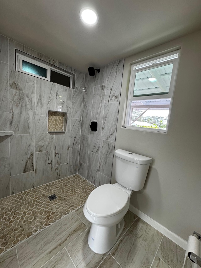 16-2045 Hanale Dr, Pahoa, HI 96778 - full bathroom featuring toilet, a tile shower, and baseboards